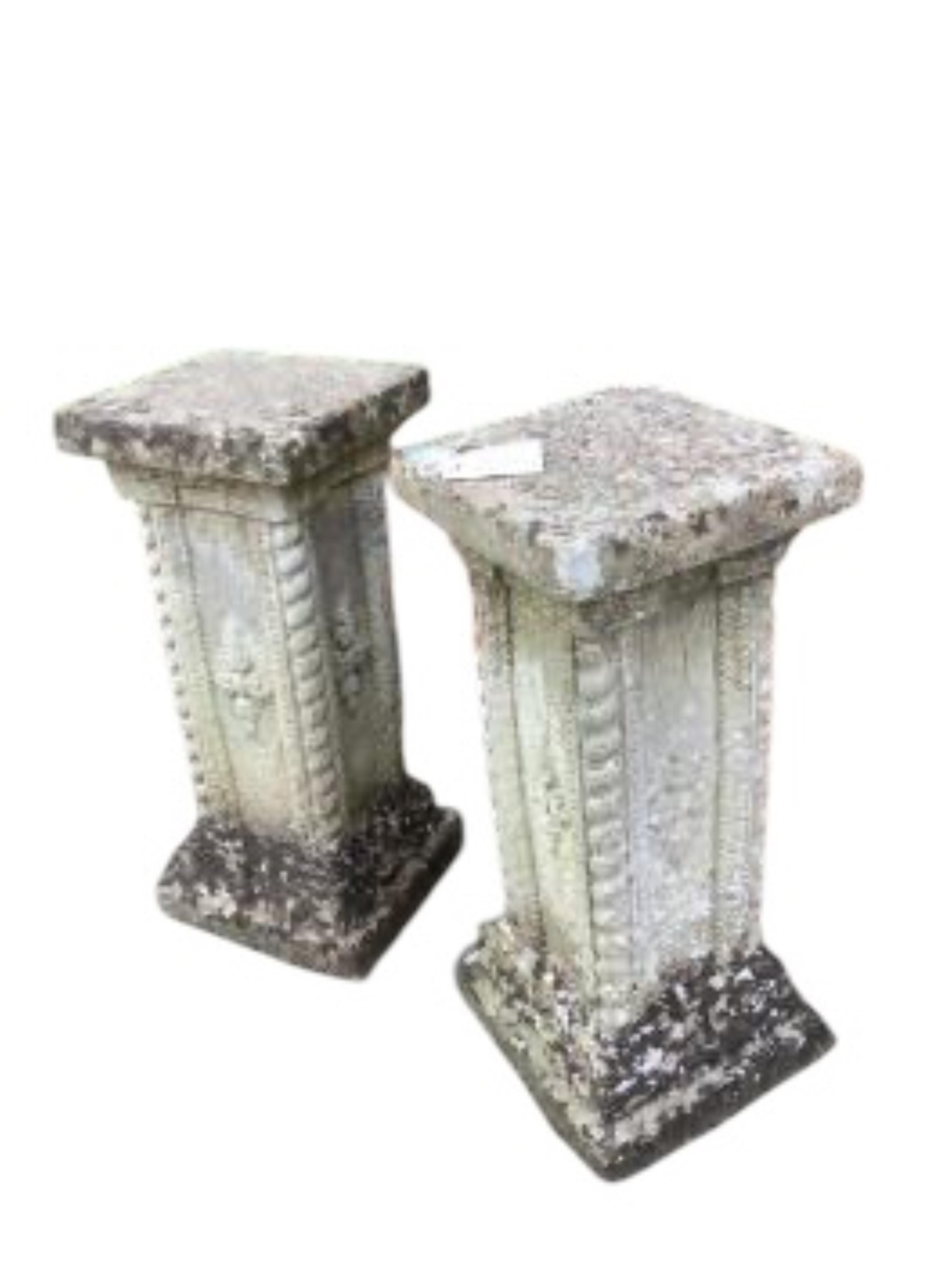 A pair of reconstituted stone garden pedestals, height 56cm